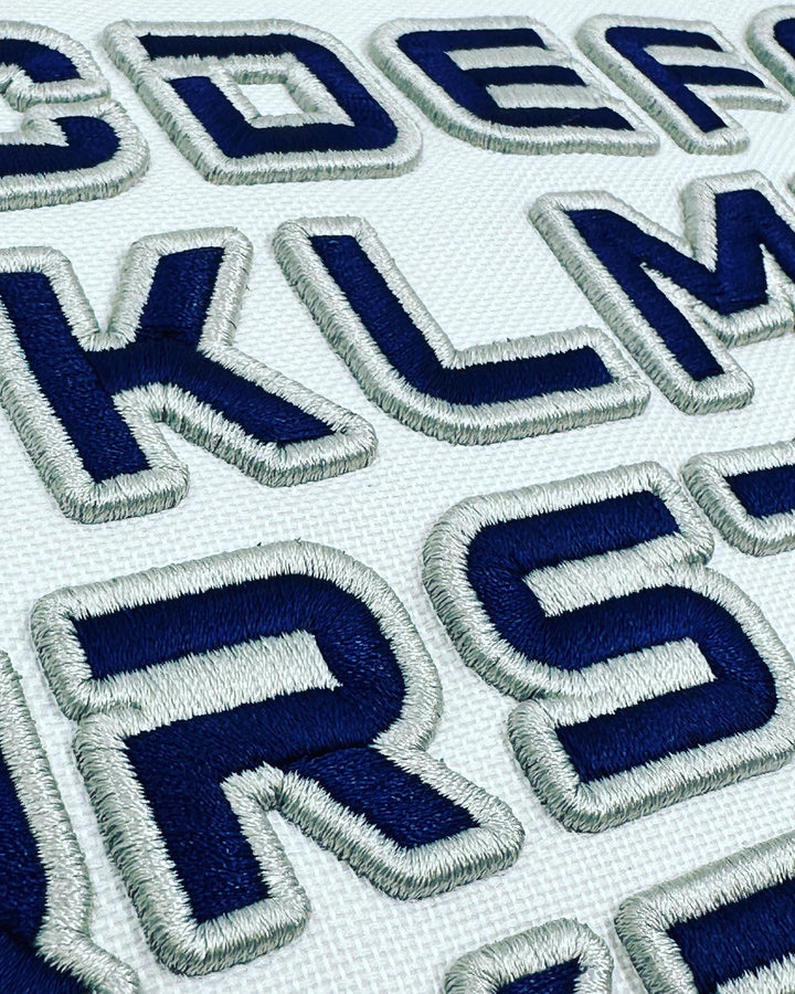 Embroidered letters on a white background