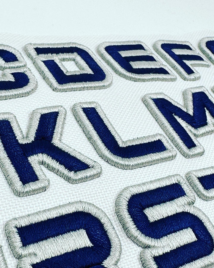 Embroidered letters on a white background