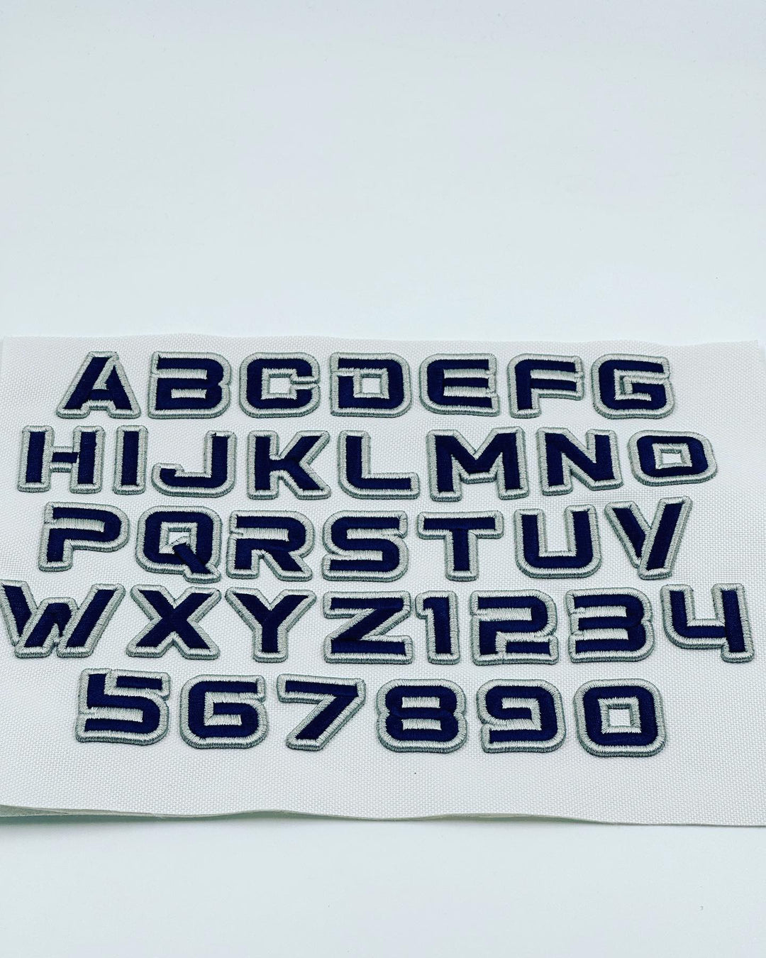 Alphabet and number decals on a white background