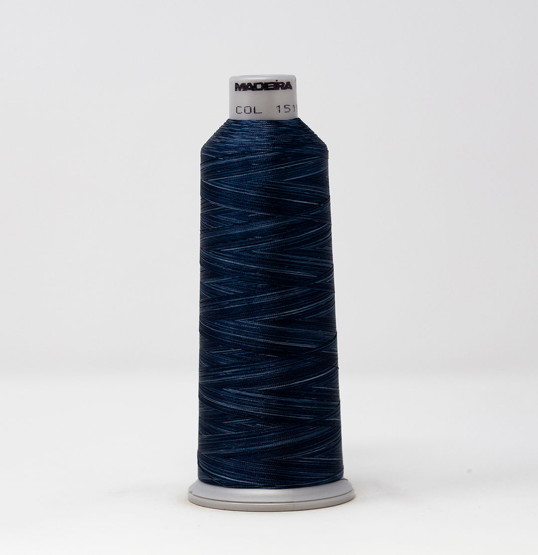 Spool of dark blue thread with a visible brand label on a white background