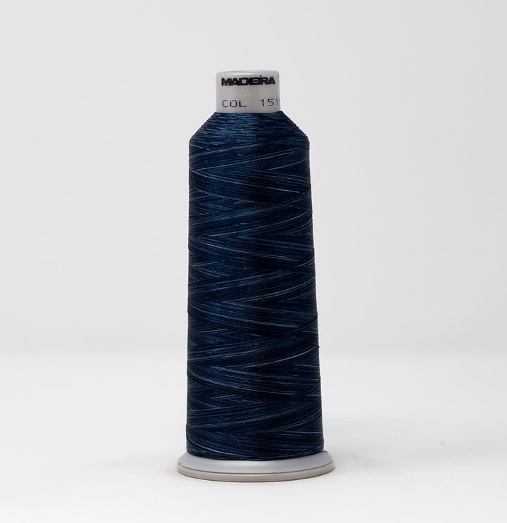 Spool of dark blue thread with a visible brand label on a white background
