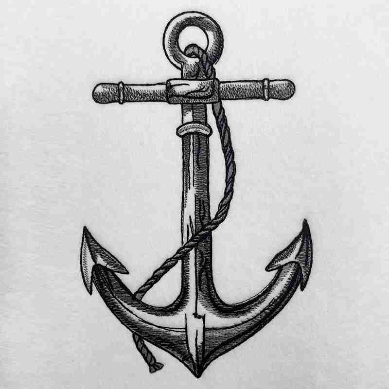 A detailed embroidered anchor design on a piece of apparel.