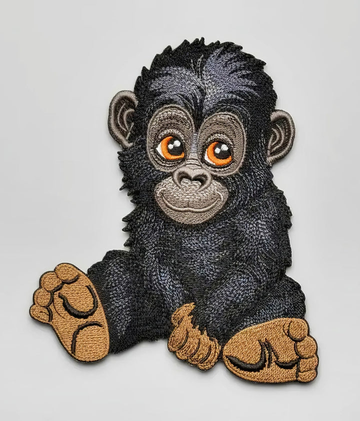 Embroidered patch of a Baby Gorilla  on a white background