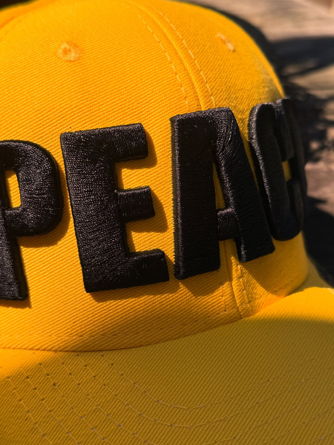 Yellow cap with &