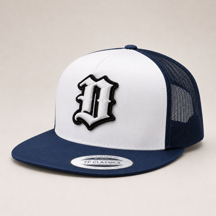 White and navy blue cap with a logo on a beige background