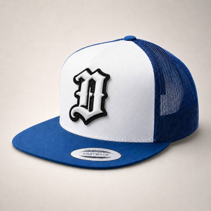 Blue and white trucker cap with a logo on a beige background