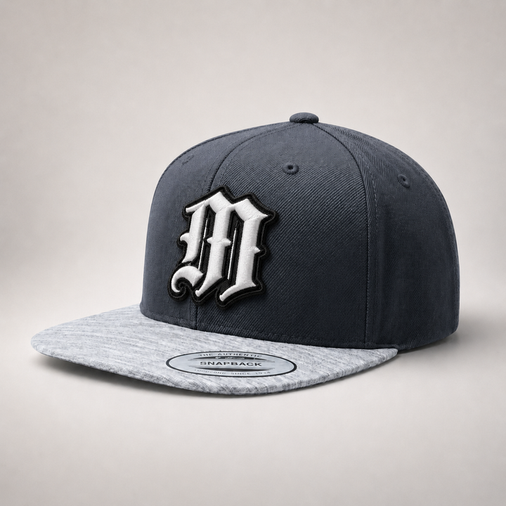 Gray and white cap with a large &