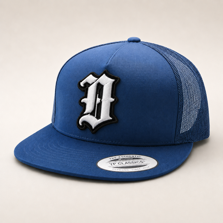 Blue cap with a white and black logo on a beige background