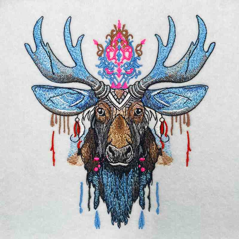 A colorful embroidery design of a moose with blue and brown colors, featuring intricate details and decorative elements.