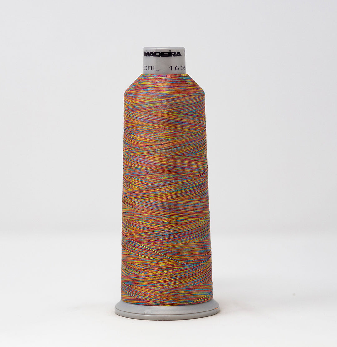 Spool of Maderia thread with multicolor pattern on a white background