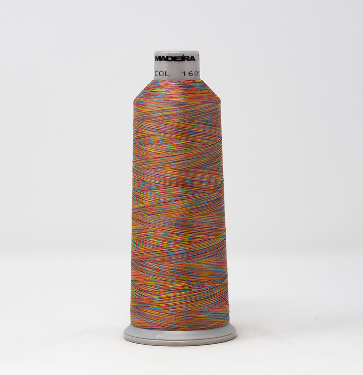 Spool of Maderia thread with multicolor pattern on a white background