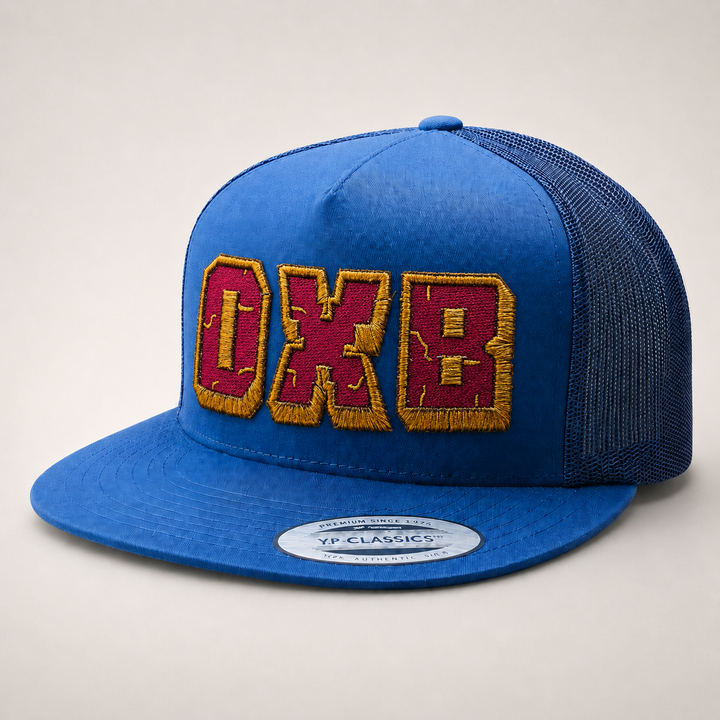 Blue cap with red and yellow text on a light gray background