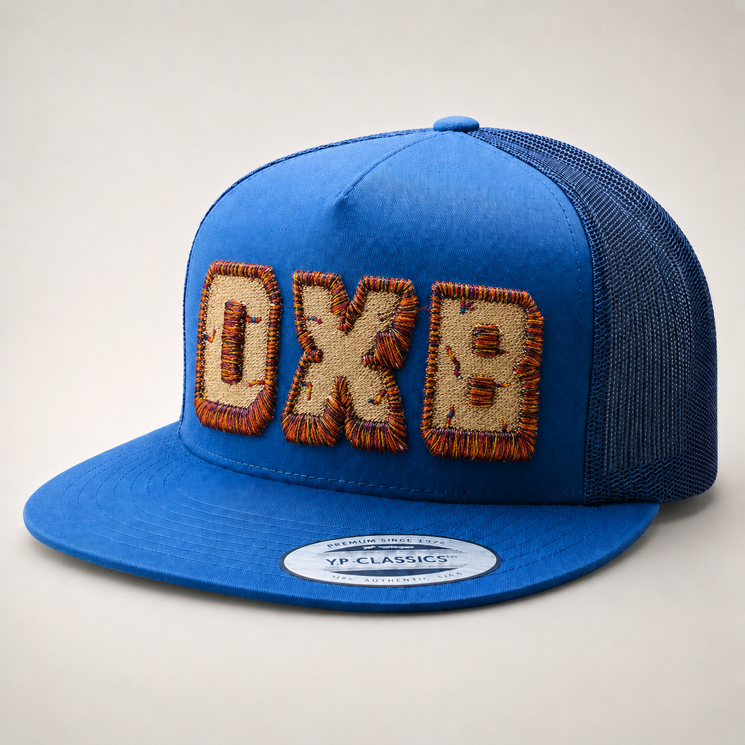 Blue cap with embroidered text on a light gray background