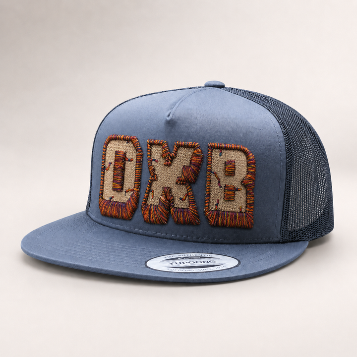 Blue trucker cap with embroidered logo on a light gray background