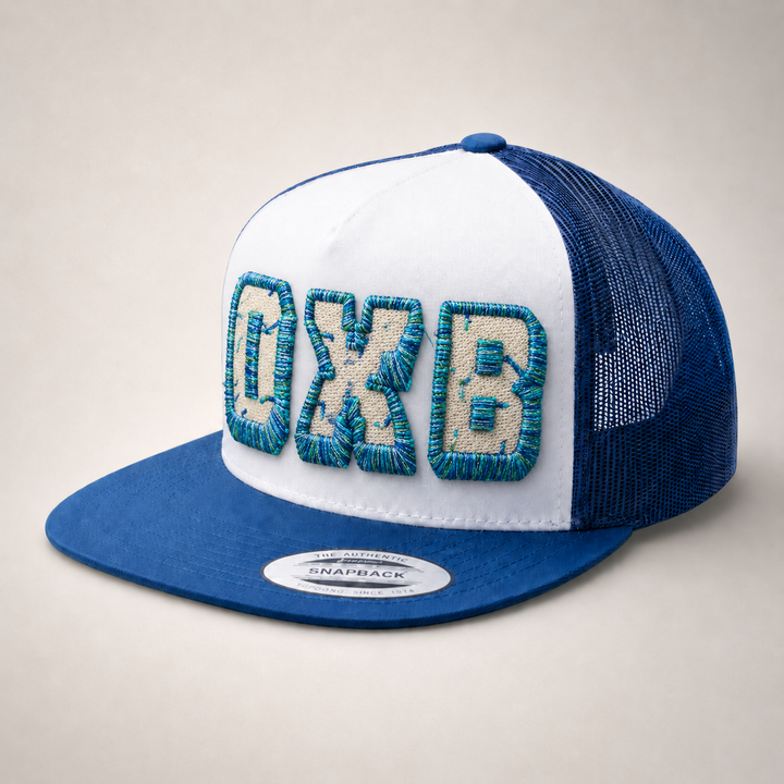 Blue and white cap with embroidered text on a beige background