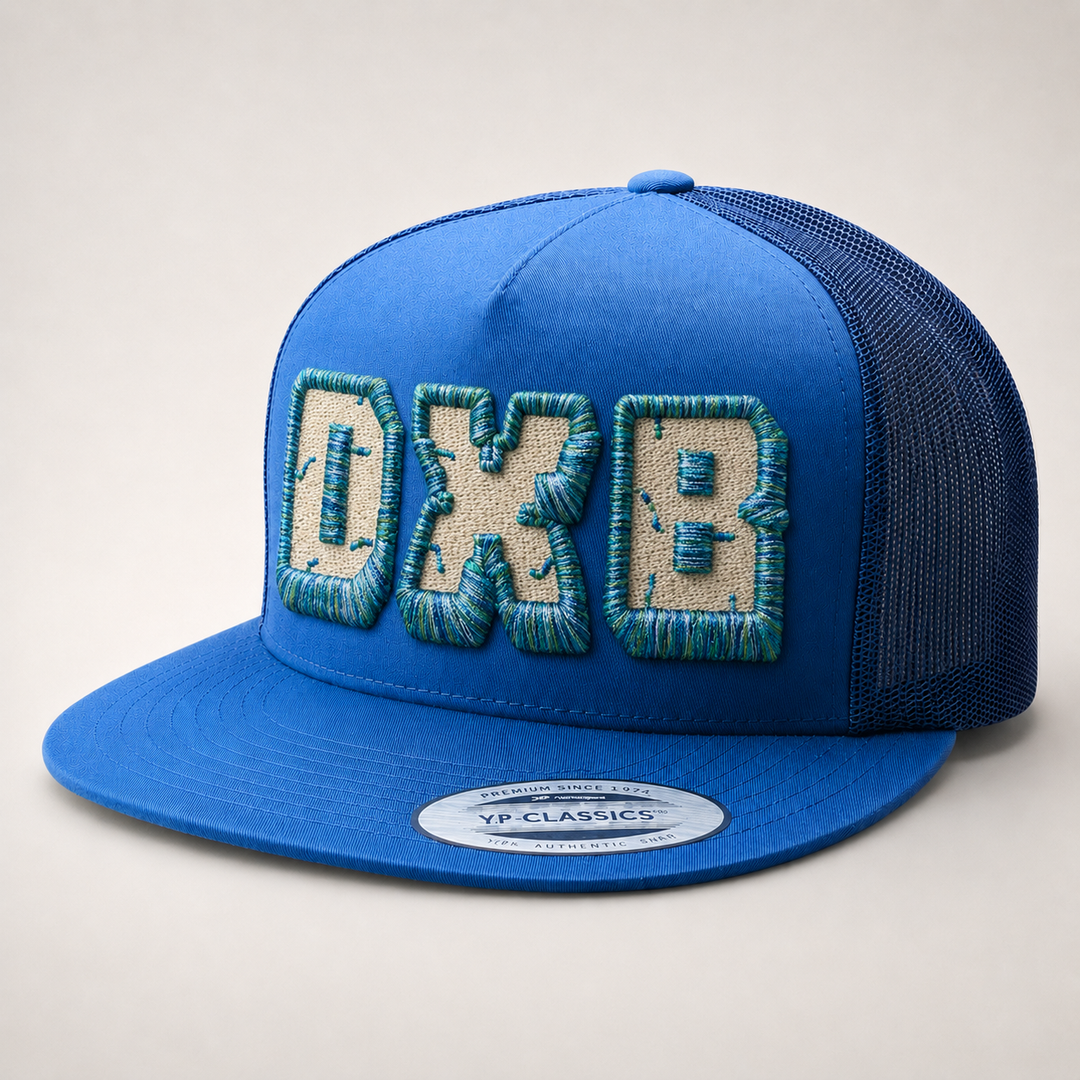 Blue cap with embroidered text on a light gray background