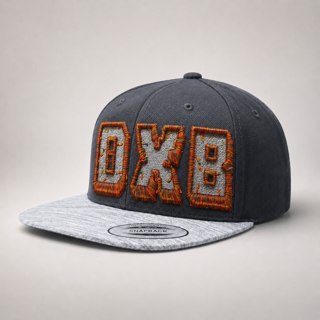 Gray and black cap with orange and white text on a light gray background