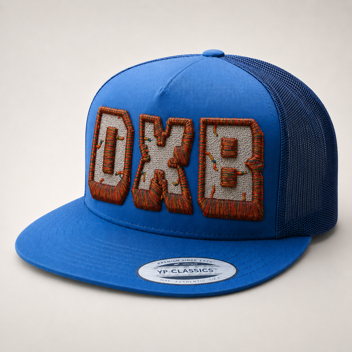 Blue cap with embroidered text on a light gray background