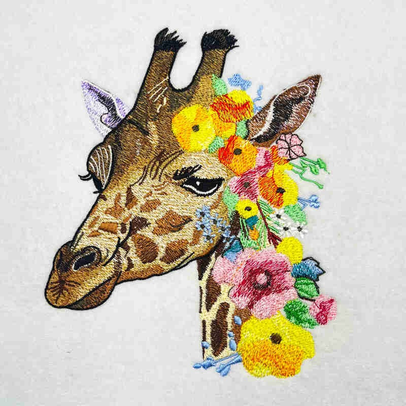 Embroidered sweatshirt featuring a giraffe's head with a floral design.