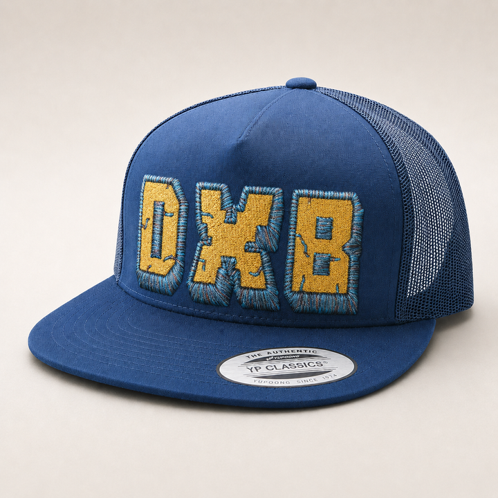 Blue cap with yellow text on a beige background