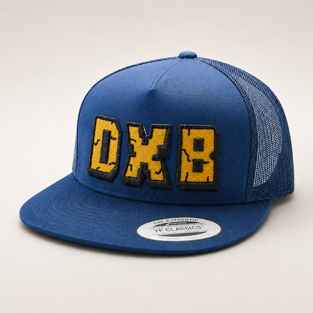 Blue cap with yellow and black text on a light gray background