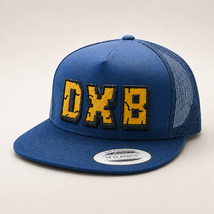 Blue cap with yellow and black text on a light gray background