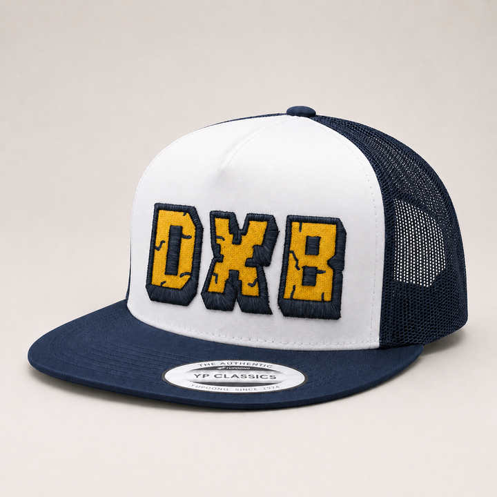 White and navy trucker hat with &