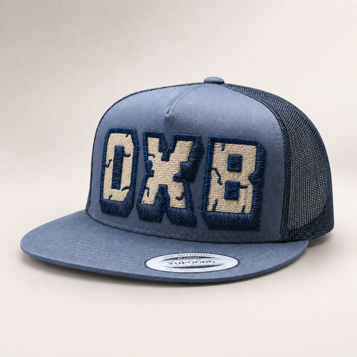 Blue trucker cap with &