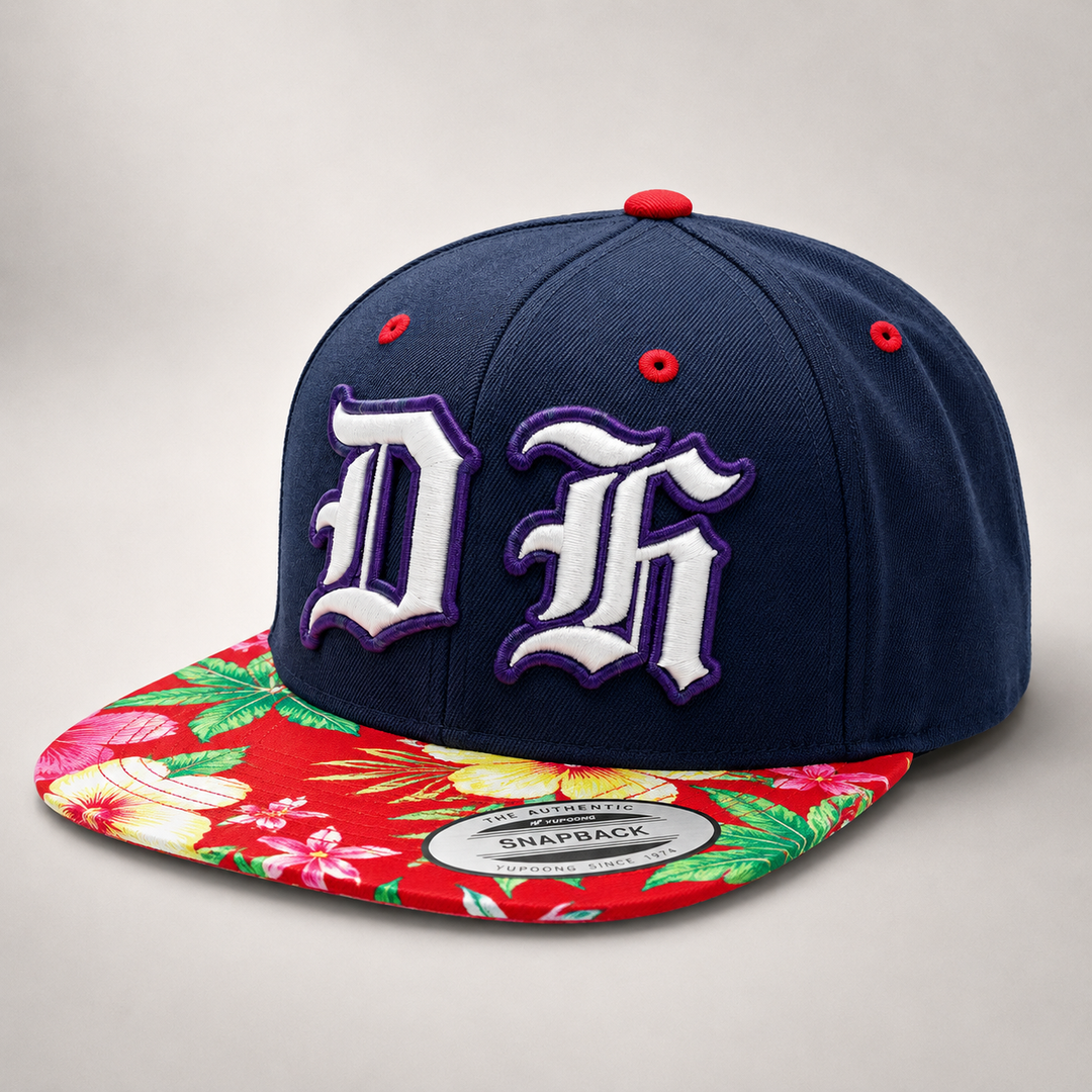 Navy blue snapback cap with floral brim on a light gray background