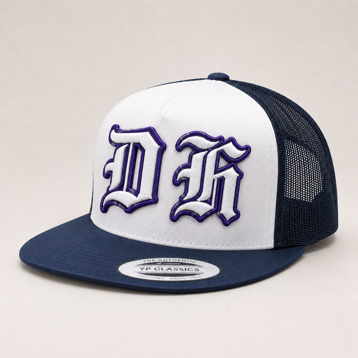 Trucker hat with white front panel and navy bill, featuring a logo on a light gray background.