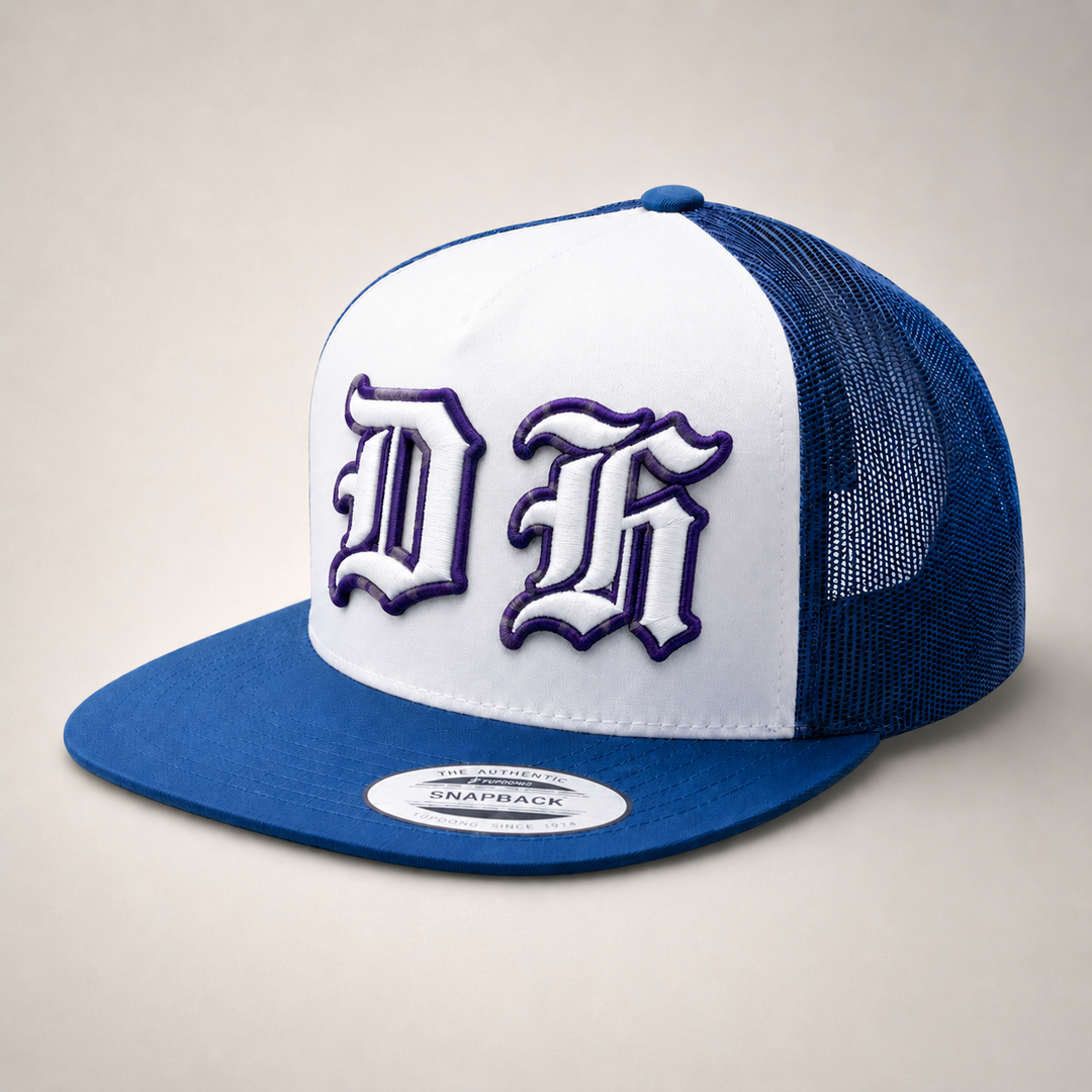 Blue and white trucker cap with a logo on a beige background