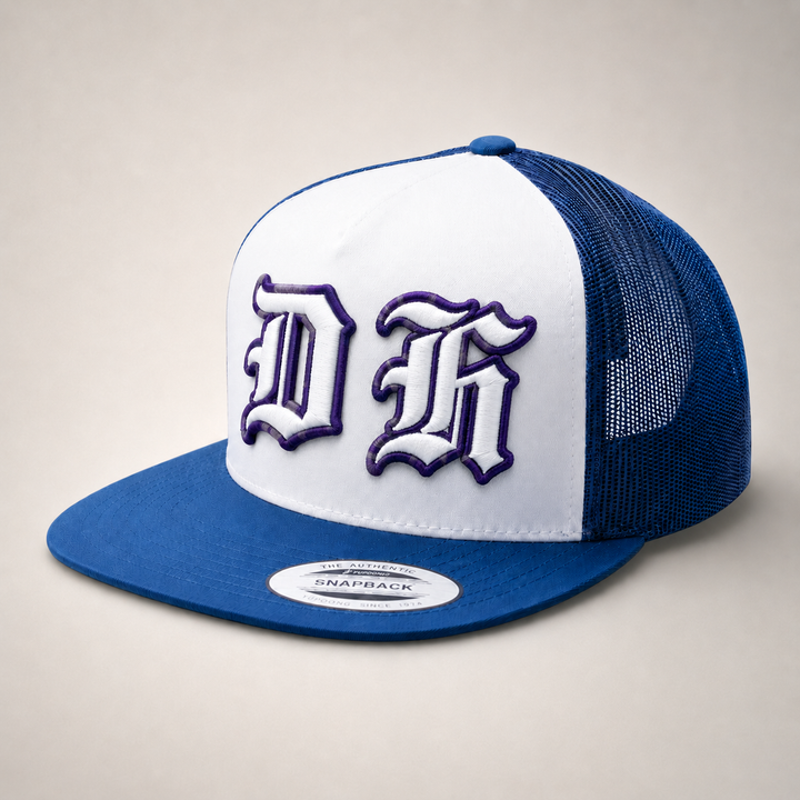 Blue and white trucker cap with a logo on a beige background