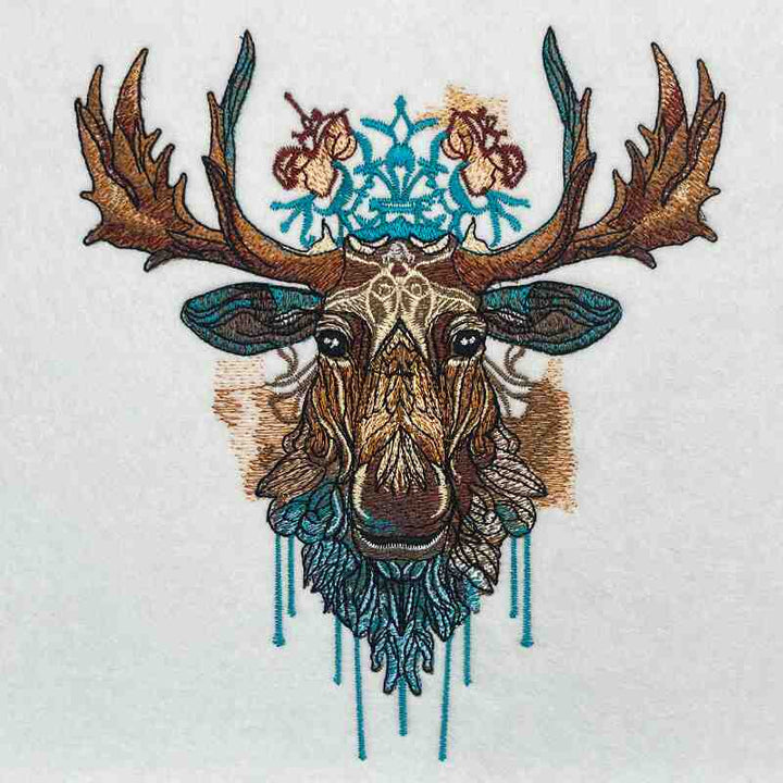 A tote bag with a moose embroidery design on the front.
