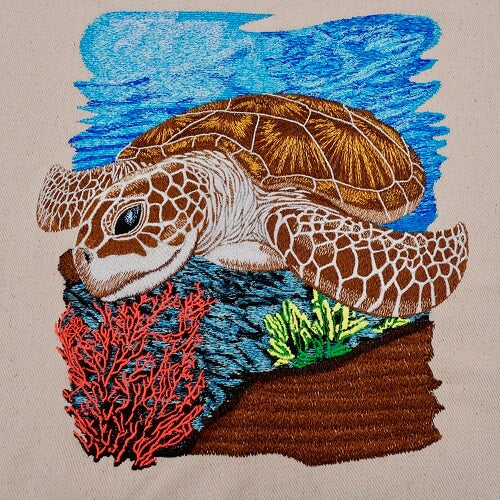 Embroidered sea turtle design on a jute tote bag