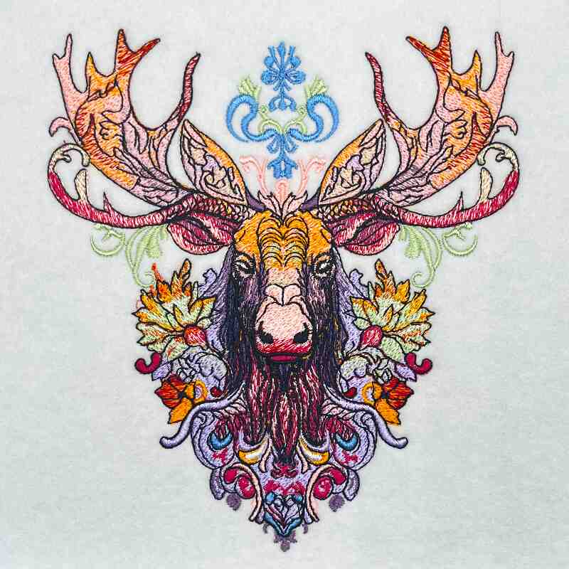 A jute tote bag with a vibrant and intricate embroidered moose design on the front.