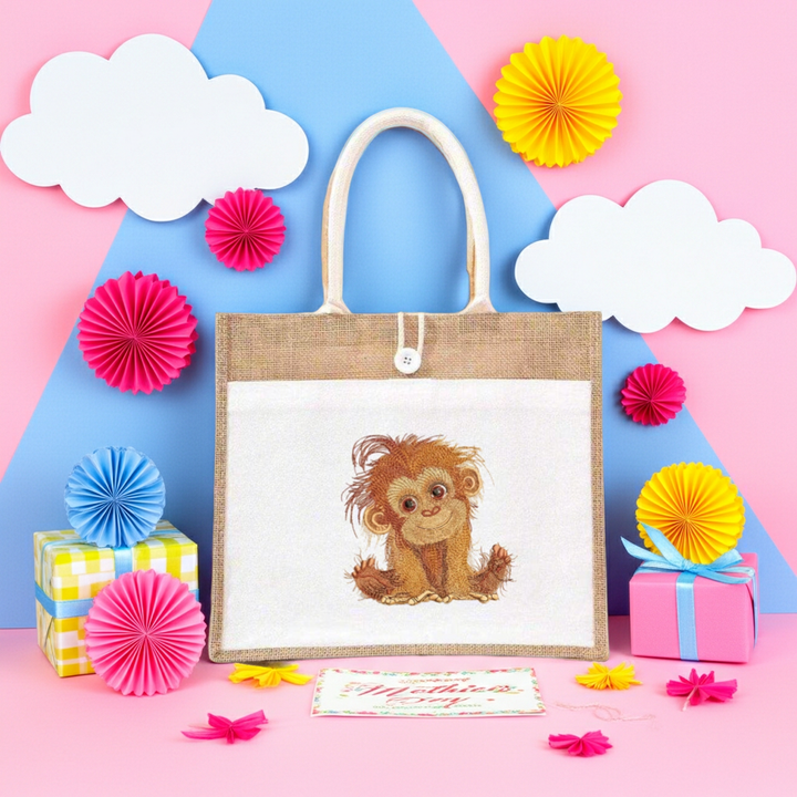 Natural jute tote handbag featuring a baby orangutan embroidery, styled on a pastel background with clouds, flowers, confetti, and wrapped gift boxes.