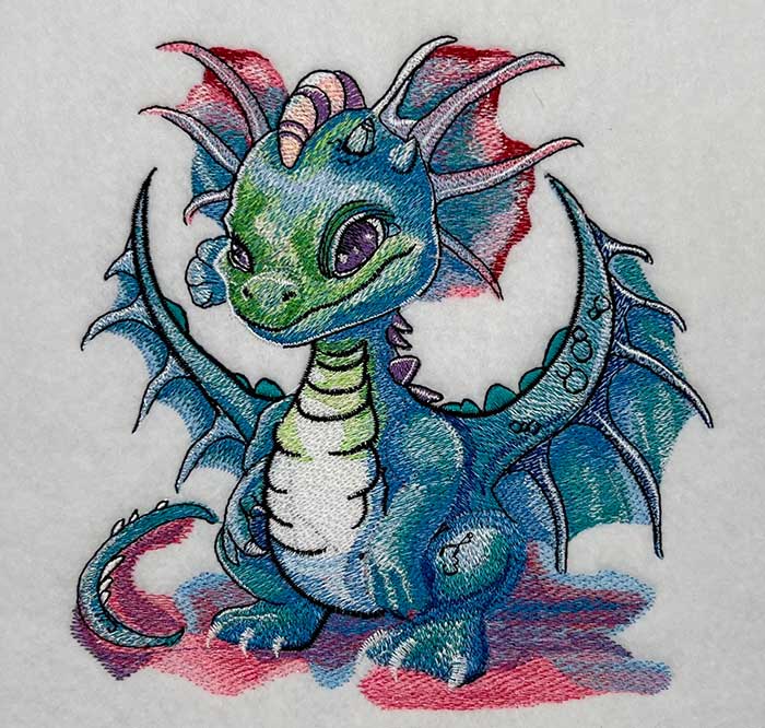 Embroidered design featuring a playful dragon design with floral elements, showcasing 3D flames and metallic threads.