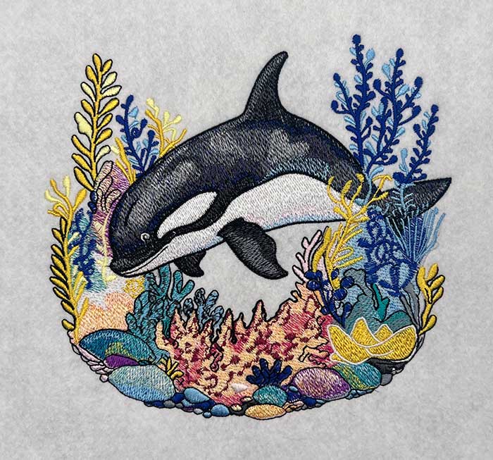 Playful Orca Coral Machine Embroidered Hoodie – Hand Finished in Dubai | EmbroMania
