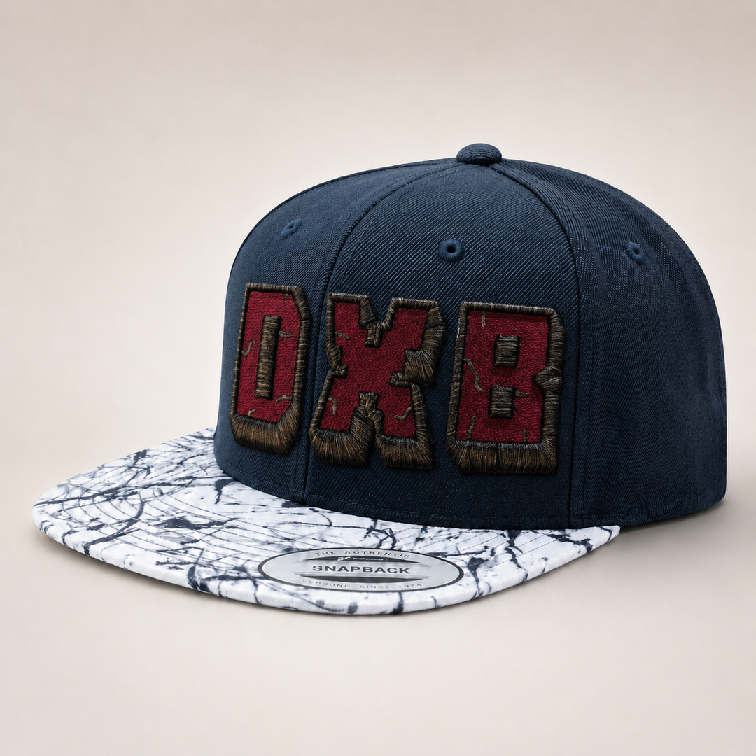 Navy blue cap with red and brown logo on a marble-patterned brim against a beige background