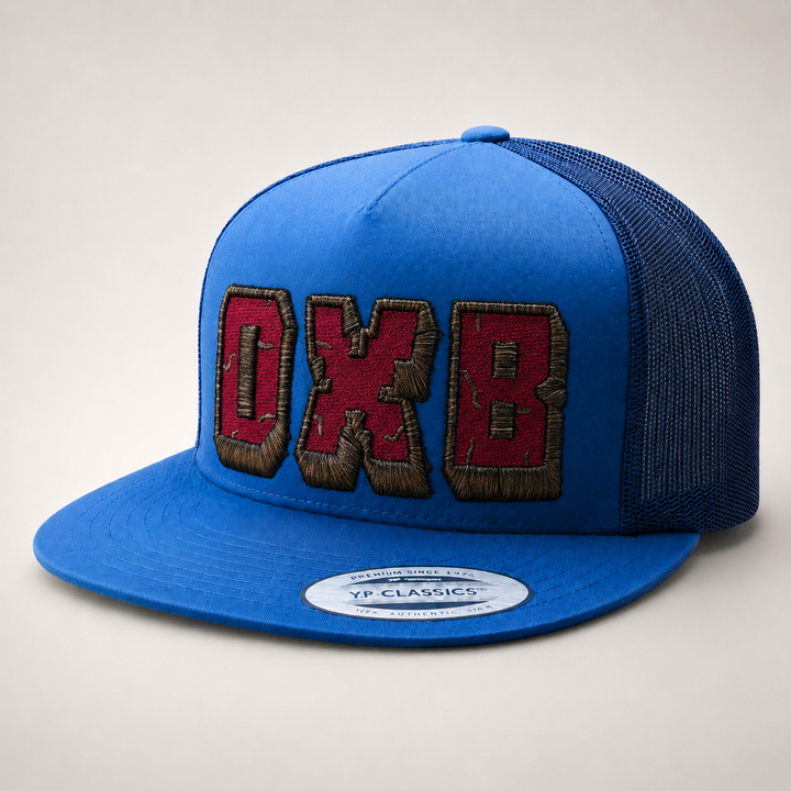 Blue cap with red and brown text on a light gray background
