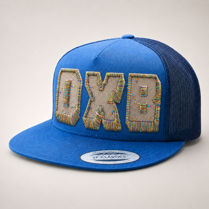 Blue cap with embroidered text on a light gray background