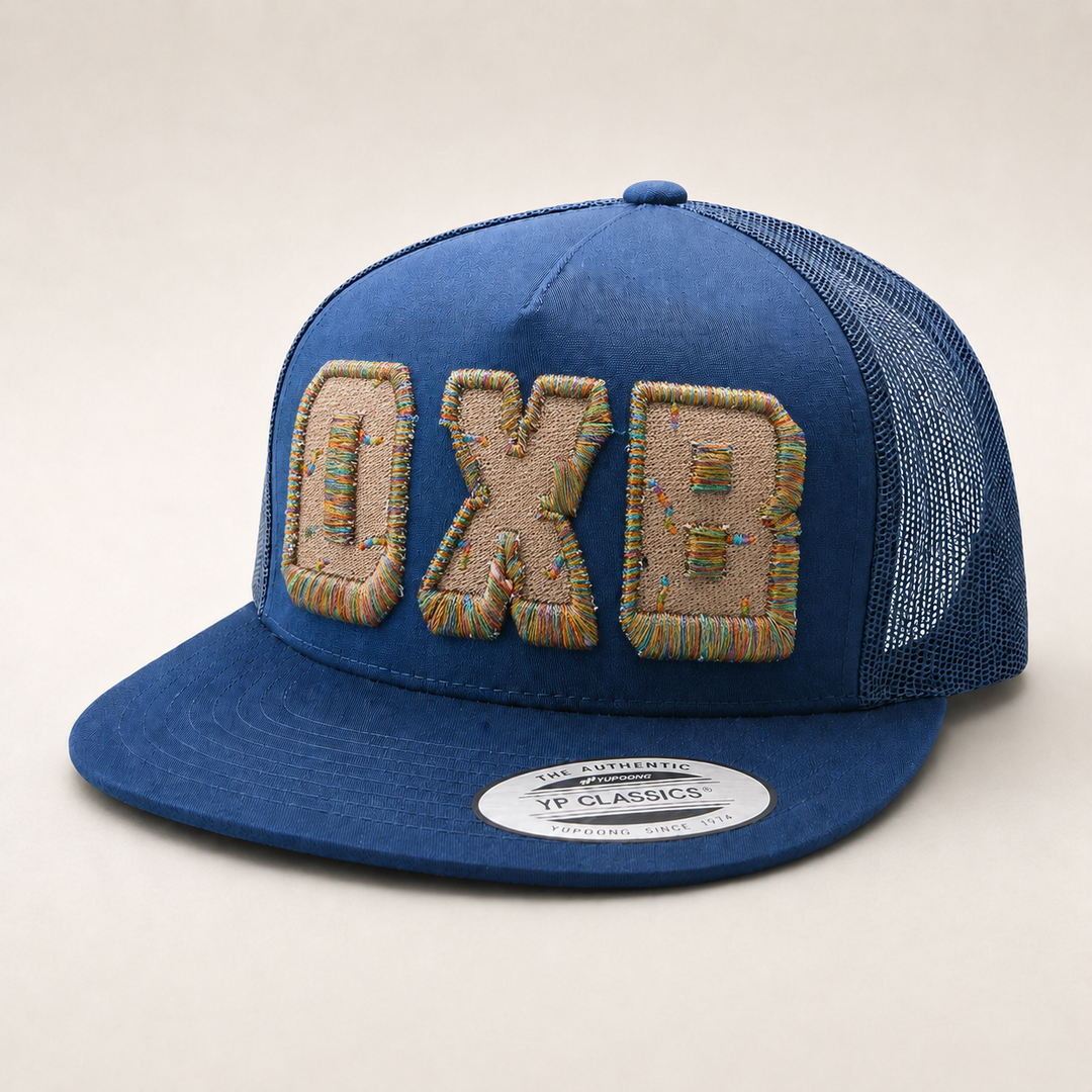 Blue trucker cap with &