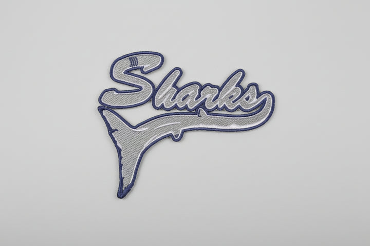 Embroidered patch with &