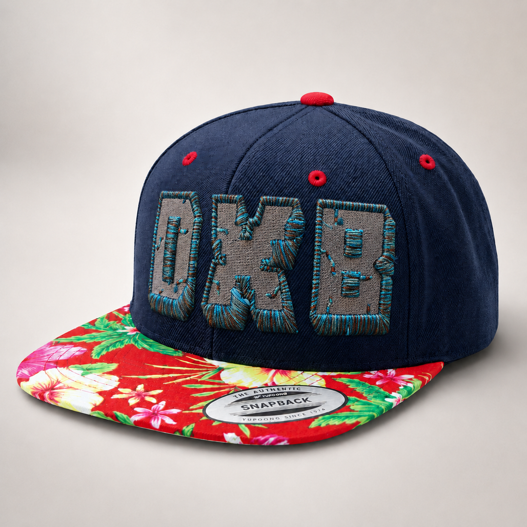 Navy blue snapback cap with floral brim on a light gray background