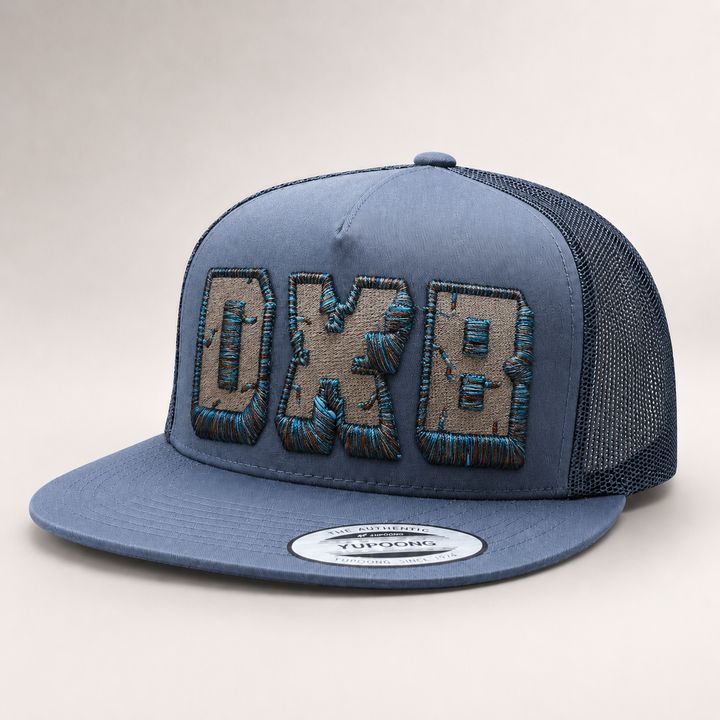 Blue trucker cap with embroidered logo on a white background