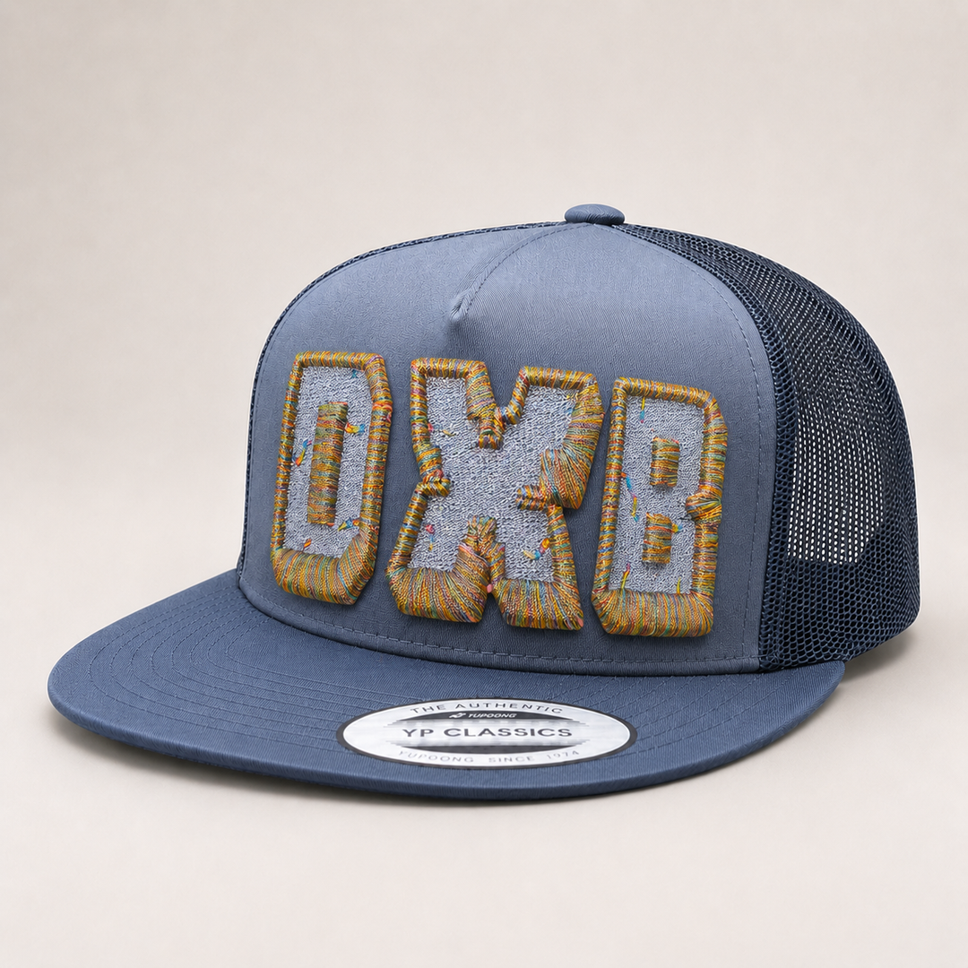 Blue trucker cap with &