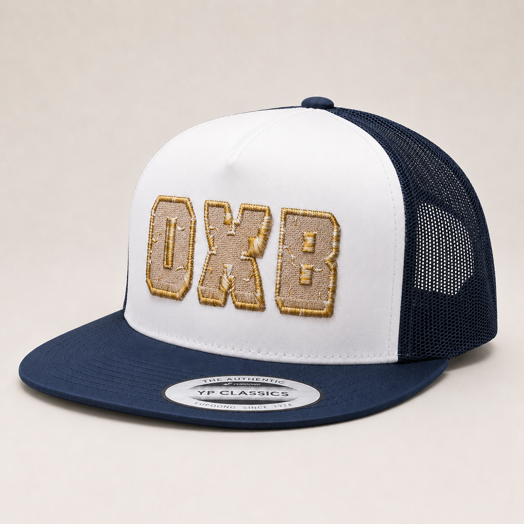 White and navy trucker hat with &