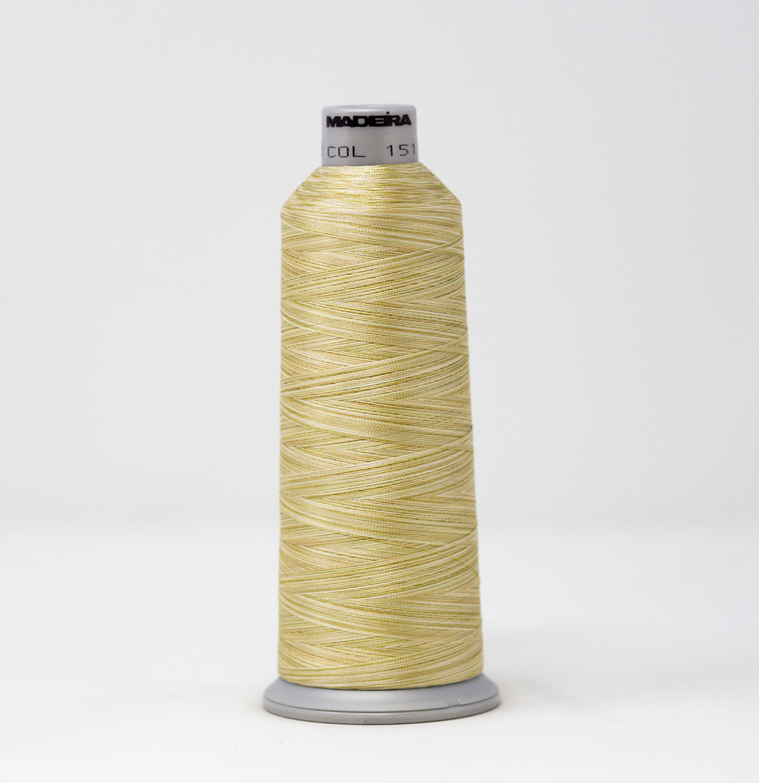 Spool of yellow thread with a visible brand label on a white background