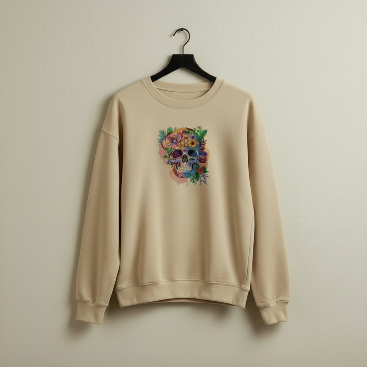 Beige sweatshirt with a colorful skull design on a beige background