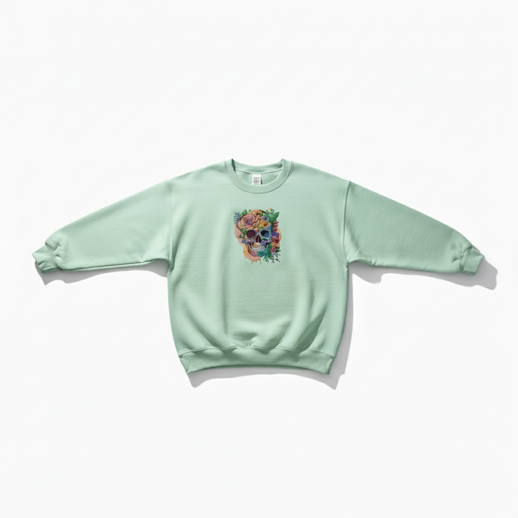 Light green sweatshirt with a colorful skull design on a white background